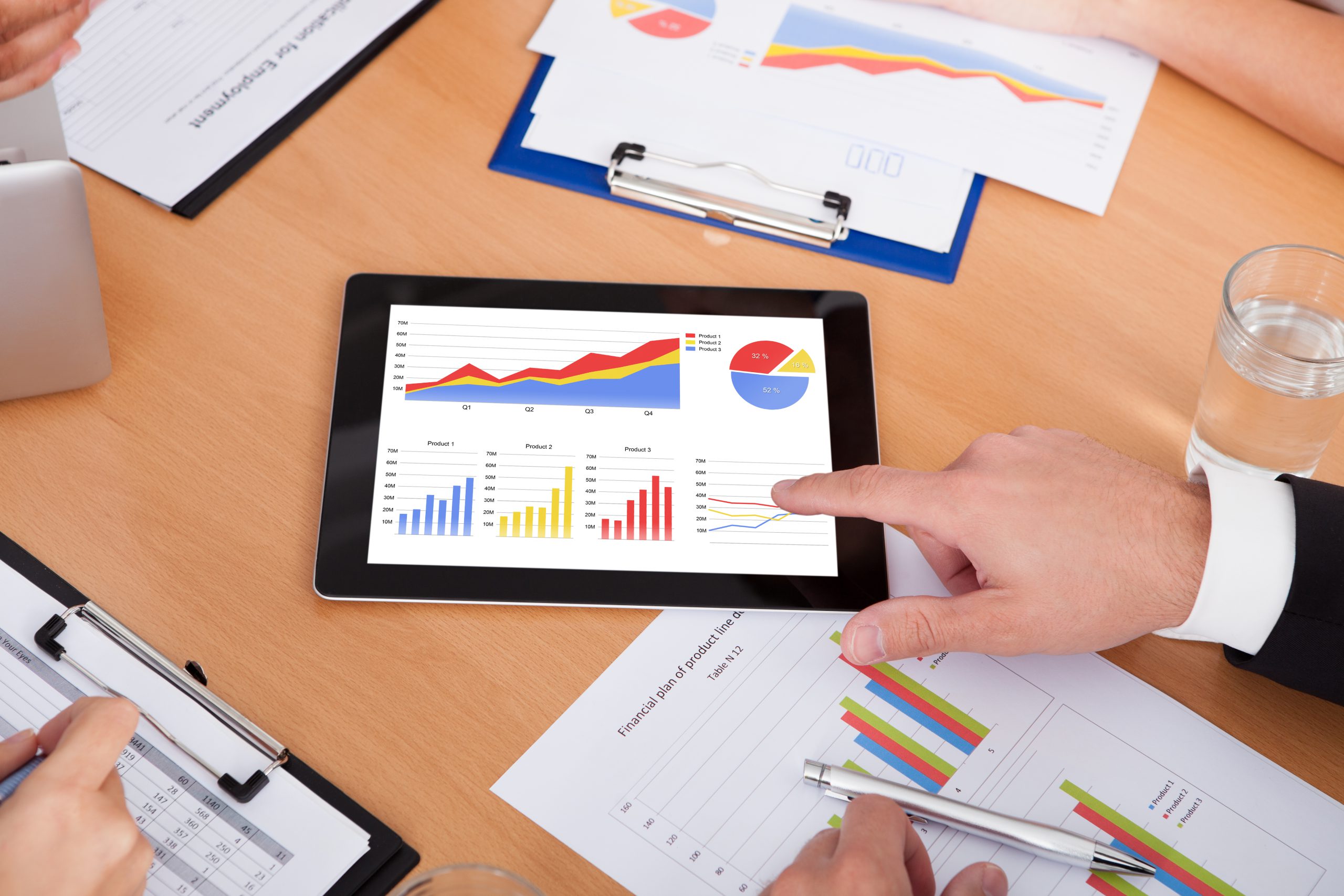 Businesspeople Pointing On Digital Tablet